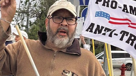 Protest organizer speaking to Dems