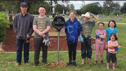 VOLUNTEERS CLEAN CEMETERY