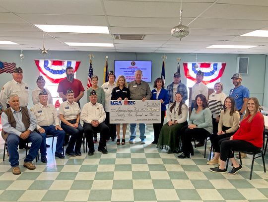 Seated from left: Richard Evans, Bandera County judge; Dennis Birchall, American Legion adjutant; Dr. Theresa Schulz and Roderick “Rod” Goff, American Legion members-at-large; Kati Fitzpatrick, BEC communications specialist; Charity Huber, BEC marketing and communications manager; Hannah C...