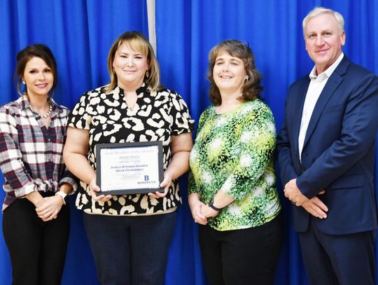 Board President Brittany Hicks with BISD Staff Member of the Month JoAnn Briones-Amador, Principal Dixie Moseley and Superintendent Gary Bitzkie.