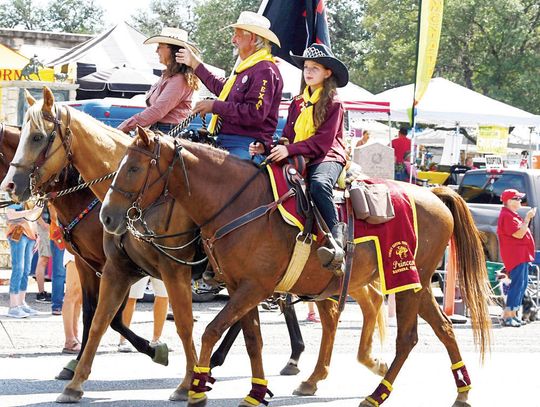 Labor Day parade includes longhorns, royalty