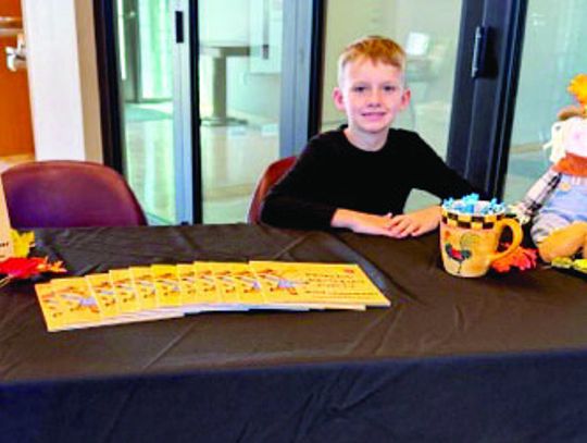 LOCAL AUTHOR PRESENTS AT LIBRARY