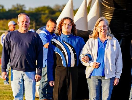 Earlier this month, David Padgett (center, pictured posing on senior night at Bulldog Stadium) was named the ATSSB All State Jazz pianist. Courtesy Photo 