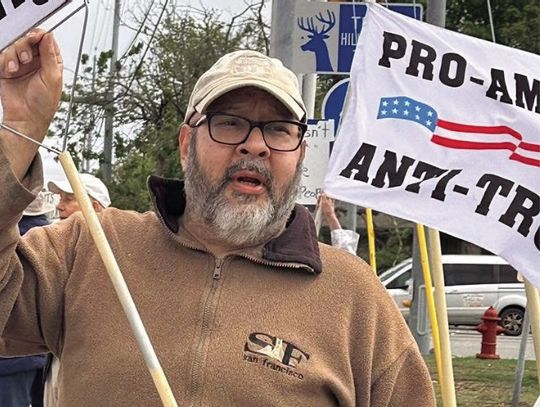 Protest organizer speaking to Dems