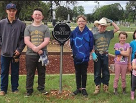 VOLUNTEERS CLEAN CEMETERY