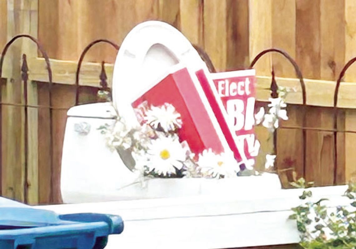 Political signs in toilet lead to criminal mischief fine